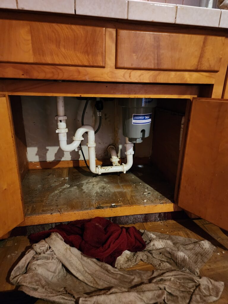 Repairing piping below a sink
